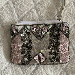 Silver sequin white colored wristlet